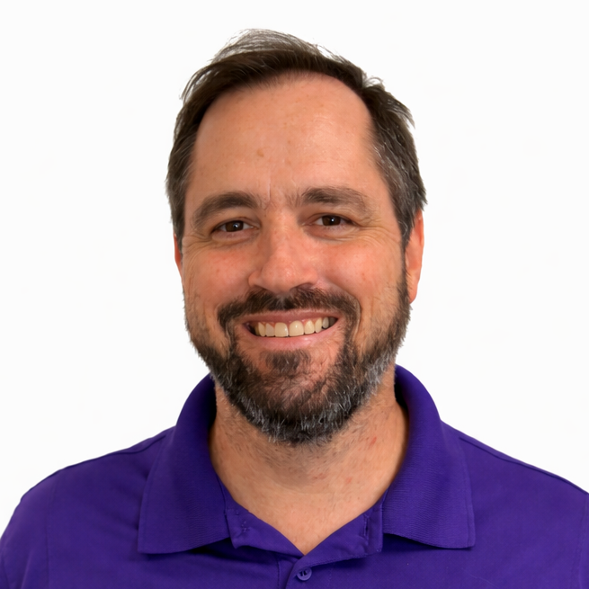 Smiling man in purple polo shirt